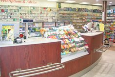 the inside of a grocery store filled with lots of food and drink bottles on display