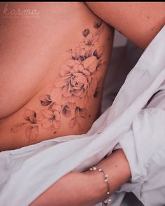 a woman's stomach with flowers on it