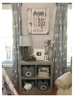 a nursery room with gray and white decor