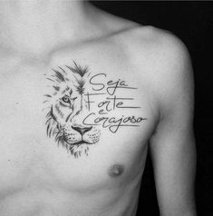 a man's chest with a lion tattoo on his chest and words written in cursive writing