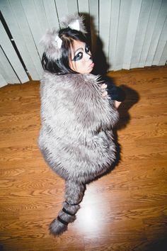 a woman in a cat costume on the floor