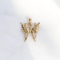 "What if I fall? ....Oh but my darling, what if you fly?" Give her the gift of wings with this beautiful butterfly necklace.DETAILS- 14k yellow gold butterflyVARIATIONSIf you require any variation of this style (a different style chain, longer chain, etc.) feel free to message us. We will do our best to accommodate you. Additional costs may apply depending on the variation.POLICYWe do accept returns on this item minus a $25 restocking fee. Return shipping is the responsibility of the buyer. Any 14k Yellow Gold Butterfly Pendant Necklace, 14k Gold Butterfly Charm Pendant Necklace, 14k Gold Butterfly Necklace Pendant, 14k Gold Butterfly Pendant Necklace, 14k Gold Butterfly Necklace Fine Jewelry, 14k Gold Butterfly Necklace, With Brave Wings She Flies, What If I Fall, Gold Butterfly Necklace