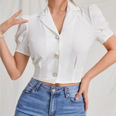 New Button Down White Crop Top Armpit To Armpit 20.4” S,4, M,6 Length 18.9” 95% Polyester, 5% Elastane Keywords: Vacation Winter Summer Spring Fall Luxury Chanel Ladies Woman’s Wear Winter All Season Shirts & Blouses Jersey Tops Party Day Going Out Shirts White Accessories Dress Style Cocktail Sleeves Cardigan Pair With Sweater Preppy Sexy Hot Boho Trendy Vogue Posh Sassy Girly Date Night Elegant Dressy Fashionable Chic Tomboy Simple Bold Fun Classy Office Classy Wedding Party Cocktail Business Cropped Top With Button Closure For Office, Blusas Crop Top, Cropped White Shirt, Going Out Shirts, Crop Top Outfits, Crop Top Shirts, Women Blouses, Button Up Blouse, Plain Shirts