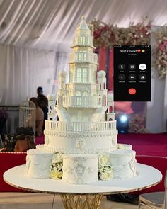 a large white cake sitting on top of a table