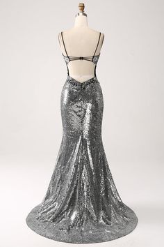 a dress on a mannequin with silver sequins