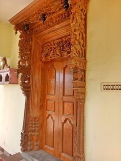 an ornate wooden door with carvings on it