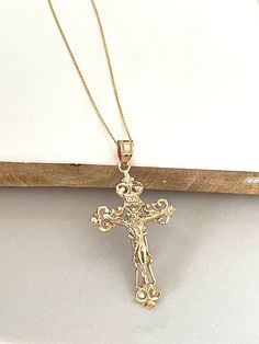 Item Specifications Handmade Yellow Gold A timeless symbol of faith and redemption. This crucifix cross is beautifully crafted in 14k yellow gold.  Whether for a baptism, confirmation, wedding, or as a thoughtful gesture of sympathy and support, our crucifix cross makes a meaningful and cherished gift for loved ones.  Cross Measurements : 45mm (With Bail) Height x 22.50mm Width Metal : 14k yellow gold Chain Style: 0.75mm Cable 16" Long Closure: Spring Ring Country Of Manufacturing------------- * Gold Cross Necklace Wedding, Christian Bride Gold Jewellery, Gold Crucifix Necklace For Wedding, Classic Crucifix Jewelry For First Communion, Elegant Cross Charms For First Communion, Yellow Gold Crucifix Necklace For Baptism, Elegant Cross Jewelry And Charms For First Communion, Yellow Gold Cross Wedding Jewelry And Charms, Elegant Crucifix Cross Necklace For First Communion