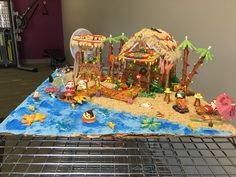 a cake that looks like it has been made to look like a pirate ship on the beach