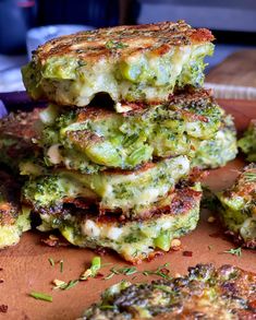 broccoli fritters stacked on top of each other with cheese and seasoning