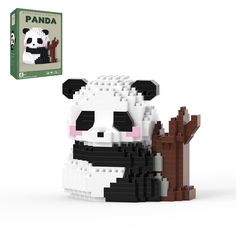 a lego panda sitting on the ground next to a box