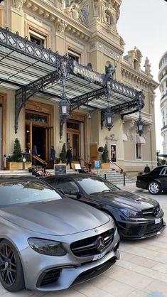 two cars parked in front of a building