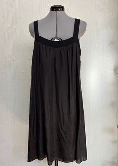 This early 2000 mini slip dress is from the brand VELVET. It is made of jersey (very comfortable) with a layer of silk of top of it. The silk is very delicate and slightly sheer. See measurements to see if it fits: Bust 18 inches across, hips 23 inches across, Length 37 inches. Elegant Black Viscose Slip Dress, Evening Slip Dress With Scoop Neck For Spring, Stretch Silk Sleeveless Mini Dress, Sleeveless Stretch Silk Mini Dress, Sleeveless Viscose Slip Dress For Night Out, Summer Daywear Slip Dress With Scoop Neck, Summer Viscose Slip Dress For Night Out, Black Sleeveless Viscose Slip Dress, Stretch Knee-length Slip Dress For Summer