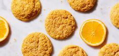 orange cookies are arranged on a white surface