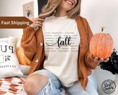 Comfort Colors® Fall Basics Shirt, Autumn Tee shirt for her, Fun Halloween Shirt Vintage Style Embrace the beauty of fall with our Charming Cute Autumn Themed Shirt! This delightful shirt features whimsical autumn graphics that capture the essence of the season, making it ideal for everything from pumpkin patch visits to cozy gatherings. Crafted from soft, breathable fabric, it offers all-day comfort and style. Pair it with your favorite jeans or leggings for a cute, casual look that celebrates Cute Fall Shirts, Whimsical Autumn, Fall Basics, Word Shirts, Cute Autumn, Fall Tee, Pumpkin Shirt, Fall Gifts, Gift Cute