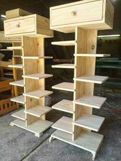 several wooden shelves are stacked on top of each other