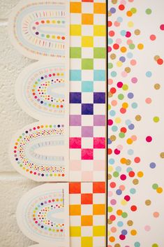 three different colored papers with dots and circles on the paper next to eachother