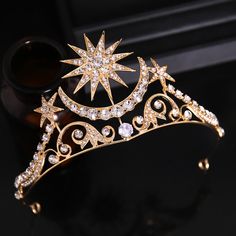 a gold tiara with white and clear stones