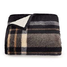 the black and white plaid blanket is folded up