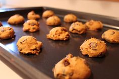 chocolate chip cookies on a cookie sheet ready to be baked