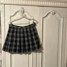 Waist Is 14 1/2 Inches Across And 15” Long Very Dark Navy Blue With White Plaid And Navy Built In Shorts Underneath For No Oh Oh Moments! Nwot Never Worn Size Says Large But Go By Dimensions, Definitely A Mini Skirt, Super Cute! Plaid Mini Skirt Skort For School Uniform, Plaid Mini Skort For School Uniform, Cotton School Skirt Short Length, Plaid Pleated Short Skort, Casual High Waist Plaid Skort, Cotton Short Skirt For School, Preppy School Skirt Bottoms, Preppy Mini Length School Bottoms, Casual Lined Mini Skirt For School