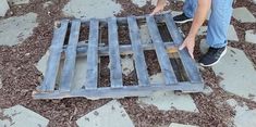 a man is working on something that looks like a bed frame with metal bars attached to it