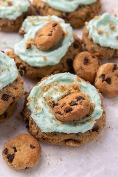 cookies with mint frosting and chocolate chip cookie doughnuts on white parchment paper