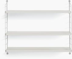 three white shelves with wheels on each side and one shelf holding two bookshelves