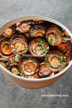 a bowl filled with lots of food on top of a table