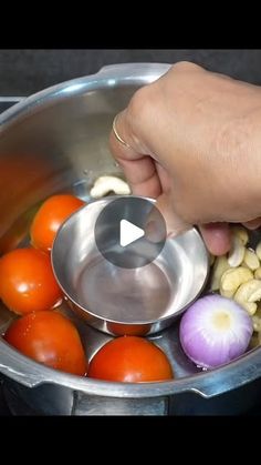 a person is stirring some food in a pot