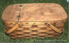 an old wooden basket sitting in the grass