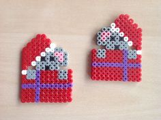 two pieces of bead art made to look like santas sleigh bells