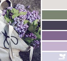 a bag with scissors and purple flowers on the side next to it is color swatches