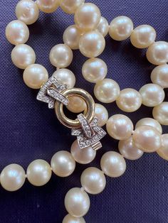 Superb 1980s, Akoya cultured salt sea, pearl necklace containing 74 lustrous white creamy colour, well matched, round pearls of very fine quality, freshly knotted. The pearls are measuring 9 mm diameter, terminating with an 18k yellow and white gold clasp set with 24 brilliant diamonds weighing combined approx. 0.72 carat. A classic beauty, elegant long length and very smooth on the skin. Period: Vintage 1980s. Condition: Very good condition, clasp works perfectly well. Weight: 88.3 grams.   Nec Formal Yellow Gold Pearl Necklace, Vintage Gold Akoya Pearl Necklace, Vintage Akoya Pearl Necklace For Formal Occasions, Timeless Round Pearl Necklace For Formal Occasions, Formal Yellow Gold Pearl Necklace With Round Beads, Classic Round Pearl Necklace With 17 Jewels, Yellow Gold Round Pearl Necklace, Pearl Necklace For Anniversary, Vintage Akoya Pearl Drop Necklace