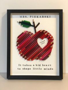 an apple made out of colored pencils with a quote on the front that says, it takes a big heart to shape little minds