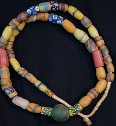 Its Beautiful Lovely Color of Ancient African Beads Wonderful Old Necklace it used to be called tribal Beads like in past they used instead of money Length 52cm Traditional Adjustable Single Strand Beaded Necklace, Traditional Adjustable Single Strand Beaded Necklaces, Artisan Beaded Necklaces For Festivals, Bohemian Single Strand Beaded Bracelets With Round Beads, Traditional Single Strand Beaded Necklace, Bohemian Yellow Single Strand Beaded Necklace, Yellow Bohemian Single Strand Beaded Necklace, Traditional Multicolor Single Strand Beads, Traditional Single Strand Necklaces For Festivals