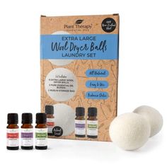 four essential oils for dry skin in front of an extra large wall dancer balls laundry set