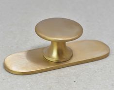 an image of a golden door knob on the floor