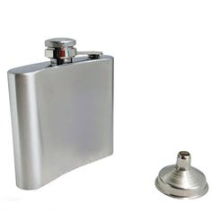 a flask shaped like a hip flask next to a bottle opener on a white background