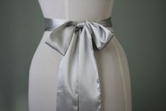 "An accessory to complement your beautiful wedding dress Made of satin fabric with flowers and belt made of satin. In the middle of the flower button is used the crystal. Flower size is approximately 5 \"dimensions. The belt length is approximately 80\"dimensions Flower fitted with lapel pins. Then, a flower can be used as a separate lapel pin. Please feel free to contact for questions and requests. PACKAGE ARE SENT BY FAST SHIPPING COMPANY WITHIN 3 TO 4 BUSINESS DAYS, TO UNITED STATES, TO CANAD