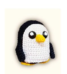 a crocheted penguin with big eyes on it's head is shown in front of a white background