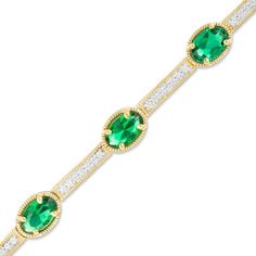 Delightfully regal, this vintage-inspired bracelet is a treasured keepsake in the making. Fashioned in sterling silver with 14K gold plate, this astonishing design features 6.0 x 4.0mm oval-shaped lab-created verdant-green emeralds alternating with lab-created white sapphire-lined bar links - each bordered in intricate milgrain detailing. Buffed to a brilliant luster, this 7.25-inch bracelet secures with a lobster claw clasp. Elegant Gold Diamond Bracelet With Birthstone, Gold Diamond Bracelet With Birthstone, Elegant Gold Diamond Birthstone Bracelet, Elegant Diamond Bracelet With Birthstone For Anniversary, Elegant Anniversary Diamond Bracelet With Birthstone, Elegant Diamond Bracelet With Birthstone For Formal Occasions, Elegant Diamond Birthstone Bracelet For Formal Occasions, Elegant May Birthstone Tennis Bracelet For Formal Occasions, Elegant May Birthstone Tennis Bracelet For Formal Events