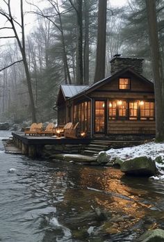 a small cabin sits on the edge of a river