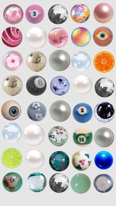 an array of different colored glass balls on a white background