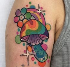 a woman with a colorful tattoo on her arm