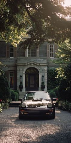 a car parked in front of a large house