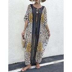 This Long Beach Cover Up Leopard Print For Women is a must-have for your summer vacation. Made from soft and lightweight chiffon/rayon fabric with a delicate print pattern all over, it is the perfect way to add a touch of style to your swimwear or summer clothing. The trendy kimono style is suitable for wearing relaxed and over your swimsuit, or as a flattering coat dress paired with casual summer clothing. This one-size cover-up fits S, M, L, and XL and features a 51.2" length, 61.4" bust, and Chiffon Cover-up For Vacation, Summer Chiffon Cover-up, Bohemian Rayon Cover-up For Vacation, Printed Beach Dress For Spring Cover-up, Vacation Rayon Cover-up, Summer Chiffon Beachwear Cover-up, Summer Chiffon Beach Dress Cover-up, Chiffon Beach Dress Cover-up For Summer, Chiffon Beach Dress For Summer