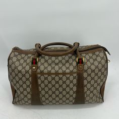 Gucci Sherryline Travel Bag Classic Gucci Monogram With Red And Green Stripped Details And Gold Hardware Approx 16x4x9.5” Has Two Top Handles And Long Shoulder / Crossbody Strap That Can Be Removed And Adjusted Date Code:40-02-073 One Interior Pocket One Exterior Pocket Functional Zippers Item Shows Signs Of Wear From Normal Use- Peeling On Interior, Wear On Leather Piping And Corners, Scratches And Scuffs Throughout, Tarnished&Scratched Hardware , Wear On Long Strap Etc Please Refer To Photos For Further Details Zarjp85308 Pre-owned Rectangular Gucci Shoulder Bag, Luxury Pre-owned Brown Bag, Classic Gucci Satchel With Dust Bag, Pre-owned Designer Brown Bags, Vintage Gucci Business Bag, Vintage Gucci Bag For Business, Classic Gucci Rectangular Satchel, Pre-owned Gucci Shoulder Bag For Travel, Classic Rectangular Gucci Satchel