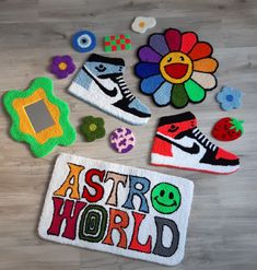 several patches and magnets are laid out on the floor next to an applique