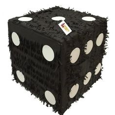 a black and white dice with holes on it