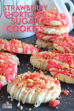 The uncomplicated and delicious sugar cookie gets a fresh, new flavour profile, and an upgrade in this Strawberry Shortcake Sugar Cookies recipe. A classic sugar cookie base is topped with a simple glaze and sprinkled with homemade shortcake crumbs. These would make a great giftable dessert idea for Valentine's Day! #sugarcookies #cookies #valentines #strawberry #shortcake